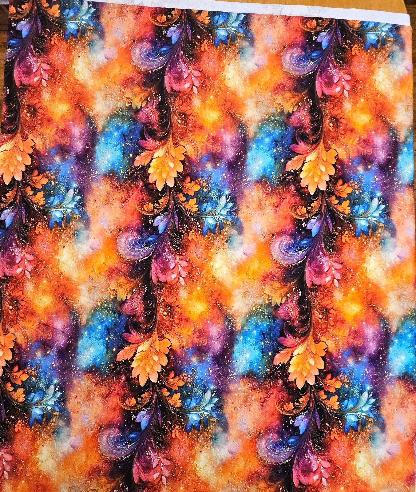 Teplákovina 240 g - ZBYTEK 0,9 m - duhové ornamenty